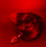 Red and black faux fur fox tail anal plug from the Be My Kinkster Kink BDSM Kit