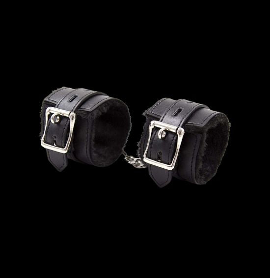 Elevate your BDSM game with our ethically-made faux fur-lined vegan leather cuffs. Designed for comfort and adjustability, these cuffs are the perfect addition to your kink collection.