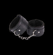 Enjoy the ultimate in comfort and luxury with our faux fur-lined vegan leather cuffs. These cuffs feature a soft lining that will keep you comfortable while adding security and adjustability to your BDSM play.