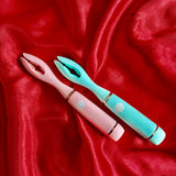 Upgrade your pleasure game with our USB rechargeable vibrating stimulator. Made of 100% body-safe silicone and waterproof for easy cleaning and versatile use, this toy offers 10 vibration patterns for customizable stimulation. Perfect for solo or couples play, this versatile toy will leave you feeling satisfied and refreshed. Shown in Pink and Aqua on Red Satin.